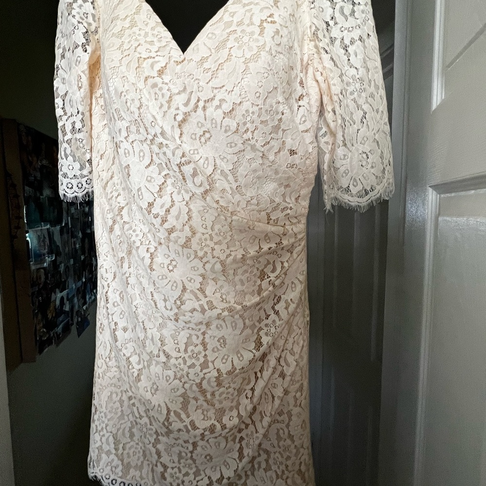 Gorgeous wedding dress brand new never worn it has a built in Bra . Very elegant